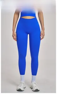 Detail of high-waist seamless yoga pants and crop top in dazzling blue for fitness