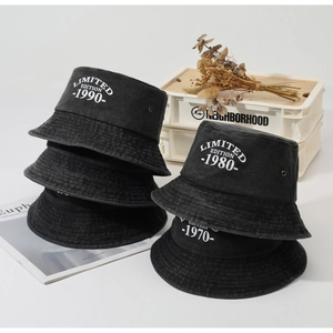 Stack of vintage washed cotton bucket hats featuring limited edition 1990 embroidery