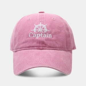 Close-up of vintage pink baseball cap with Captain embroidery and cotton texture