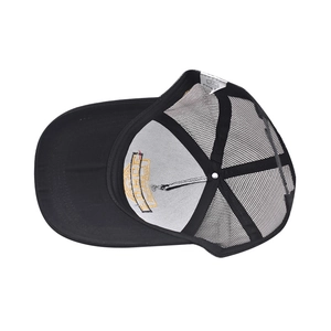 Detail of Force baseball cap interior showing embroidered yellow shield and woven care label