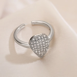Adjustable silver teardrop ring with pave cubic zirconia on a silk background