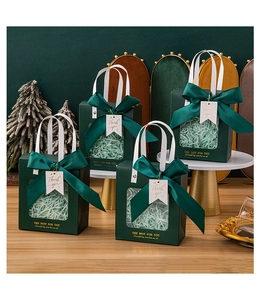 Deep green gift bag with transparent window, silk bow, and Thank You tag for holiday