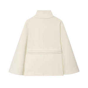 Detailed view of a white cape coat with a high collar and matching waist belt buckle