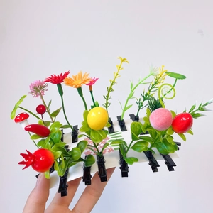 Macro shot of creative fruit and flower hair clips featuring sunflower and mushroom shapes