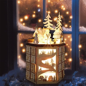 Detailed view of wooden advent calendar with 24 drawers and LED glowing winter scene