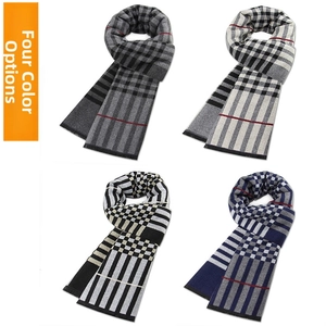 Detail view of four winter striped scarves in grey, navy and beige with red accents