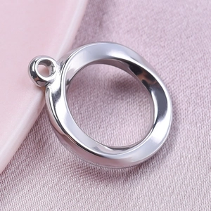 Close-up of polished 304 stainless steel round hollow pendant with a smooth silver finish