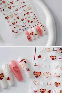 Detailed macro view of 5D embossed heart nail stickers TS-2170 in dusty rose and cream tones