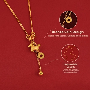 Golden zodiac horse pendant necklace with coin charm on a red textured backdrop