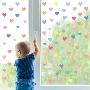 Colorful heart wall stickers for kids room featuring pastel macaron tones on glass surface