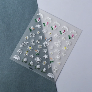 Macro shot of 5D embossed white floral nail art stickers with textured TS-213 rose design