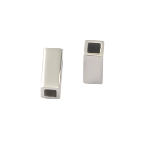 Macro shot of two silver stainless steel hollow rectangular tube beads for DIY jewelry