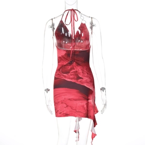 Detail view of red abstract print mini dress featuring backless tie-up design and ruffled hem