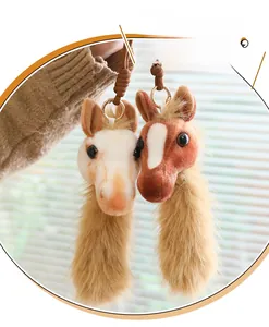 Detailed plush horse head charms in cream and brown with soft long fur and woven lanyards