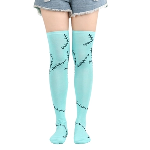 Close-up of Sally cosplay over-knee socks with black stitch patterns on teal blue fabric