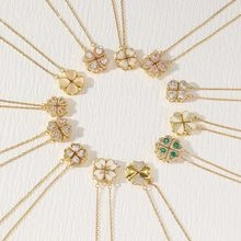Detail of magnetic folding necklace showing four-leaf clover and heart shapes