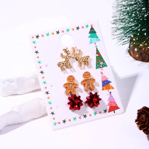 Christmas stud earring set featuring metal reindeer, gingerbread man, and red bow designs