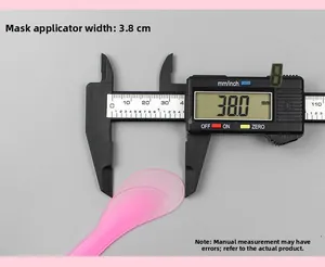 Pink plastic spatula measured with caliper showing 3.8cm width for cosmetic mixing