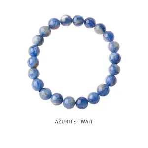 Macro detail of natural blue azurite stone beads on a minimalist beaded bracelet