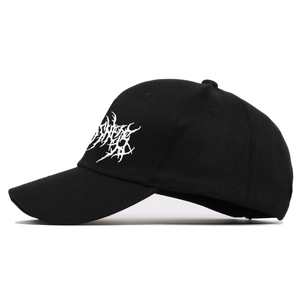 Black cotton baseball cap with white gothic embroidery and structured six-panel design