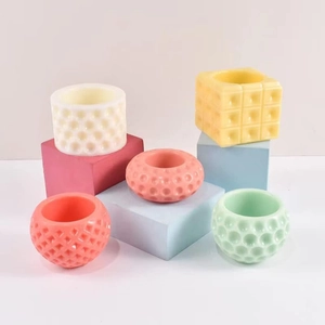 Pastel geometric silicone molds for polka dot candle cups and cylindrical resin containers