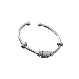 Minimalist silver zirconia open bangle featuring a sparkling paved center bead design