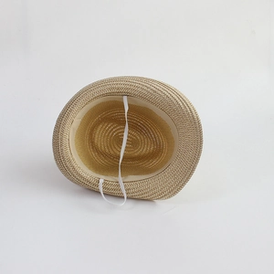 Detailed interior of a kids straw sun hat showing the sweatband and white elastic chin strap