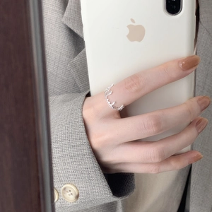 Chic silver molten irregular drip ring for women worn in a stylish mirror selfie