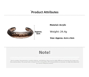 Detail of vintage acrylic cuff bangle with textured grooves and semi-transparent finish