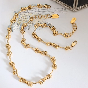 Gold-plated chunky chain jewelry set with ball pendants and LUCKY engraving on the clasp