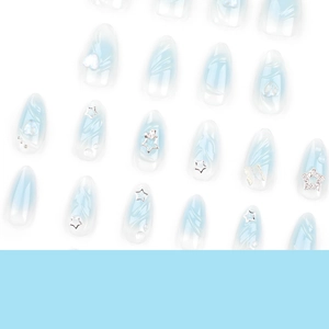 Blue marble stiletto press-on nails with 3D silver stars, hearts and butterfly charms