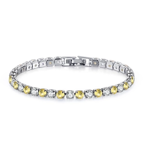 Detail of yellow and clear zircon tennis bracelet with silver plating and secure clasp