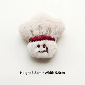 Detail of plush cartoon brooch with chef hat and golden embroidery, 5.5cm size