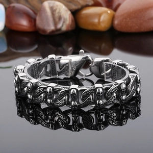 Gothic skull link bracelet in vintage stainless steel with intricate floral carvings