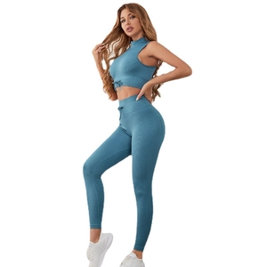 Navy blue ribbed 3-piece yoga set with drawstring sports top and high-waisted leggings