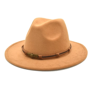 Detail of camel wool fedora hat featuring a brown braided leather band and metal buckle