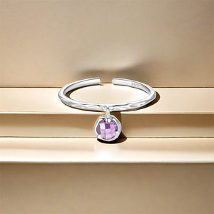 Detailed close-up of S925 sterling silver ring with hammer texture and purple zircon pendant