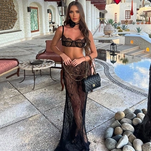 Detail of sexy black lace backless set with a sheer floor-length fishtail skirt