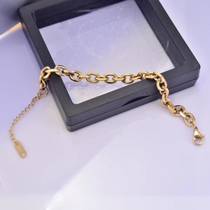 Detail of gold-plated stainless steel chunky chain bracelet with lobster clasp on a display box