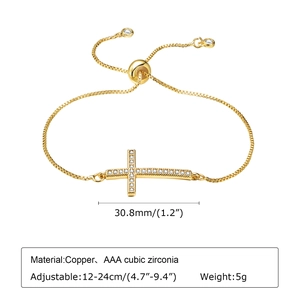 Macro shot showing dimensions of adjustable golden box chain bracelet with zircon cross