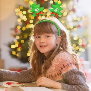 Christmas tree headband with red bows and stars worn by a model in holiday setting