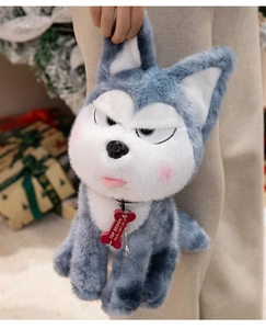 Close-up of fluffy gray husky plush toy with grumpy face and red bone tag detail