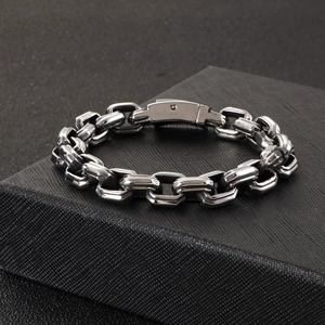 Close-up of vintage square chain bracelet with folding safety clasp in a jewelry box