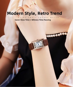 Macro shot of rectangular rose gold quartz watch with Roman numerals and brown leather strap
