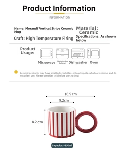 Detailed view of red and white striped ceramic mug with a creative large ring handle