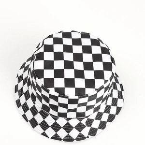 Top-down view showing black and white checkered pattern and canvas texture of the bucket hat