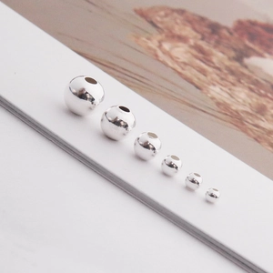 Detailed view of silver S925 spacer beads in various sizes for DIY jewelry making