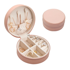 Pink round portable travel jewelry box with zipper for rings and necklaces