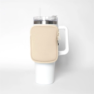 Detail of white 40oz tumbler with neoprene sleeve and beige zipper pouch attachment
