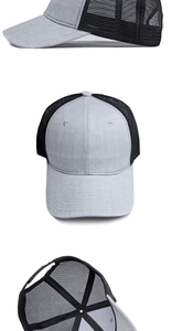 Detail view of two-tone mesh trucker hat with adjustable snapback closure and curved brim